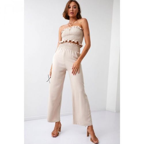 A set of women's wide pants with a short crinkled top beige