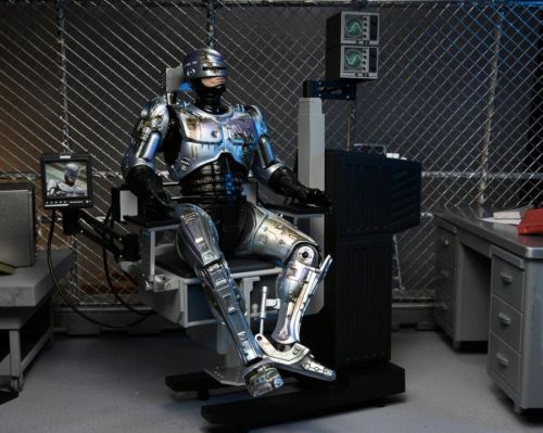 NECA | Robocop - sběratelská figurka Ultimate Battle Damaged Robocop with Chair 18 cm