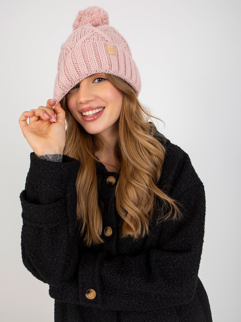 Light pink women's winter hat with a pompom