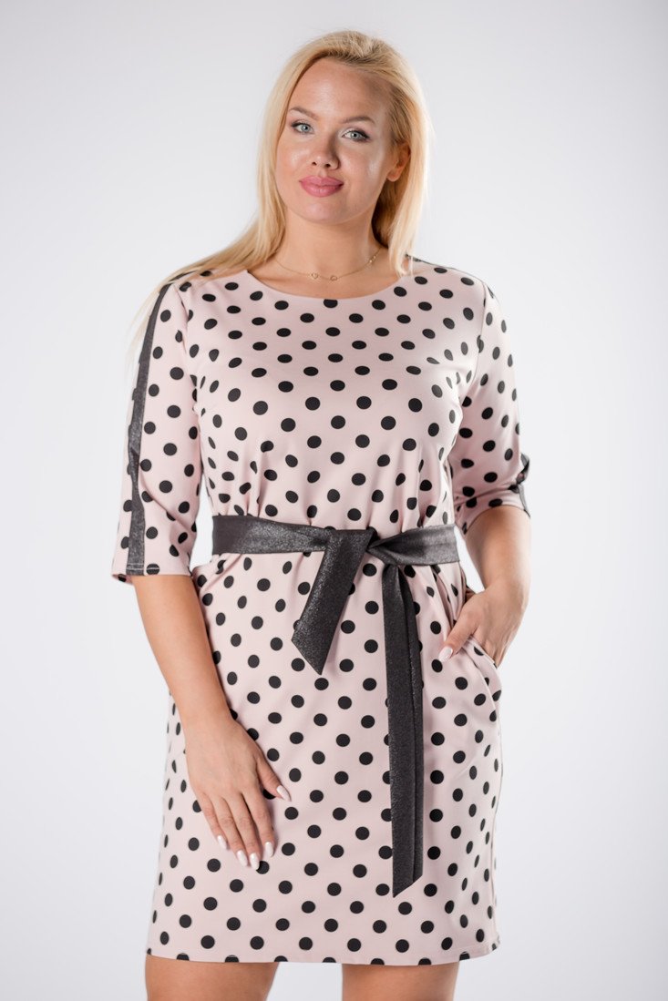 fitted polka dot dress with glittering stripes on the sleeves and a tie at the waist