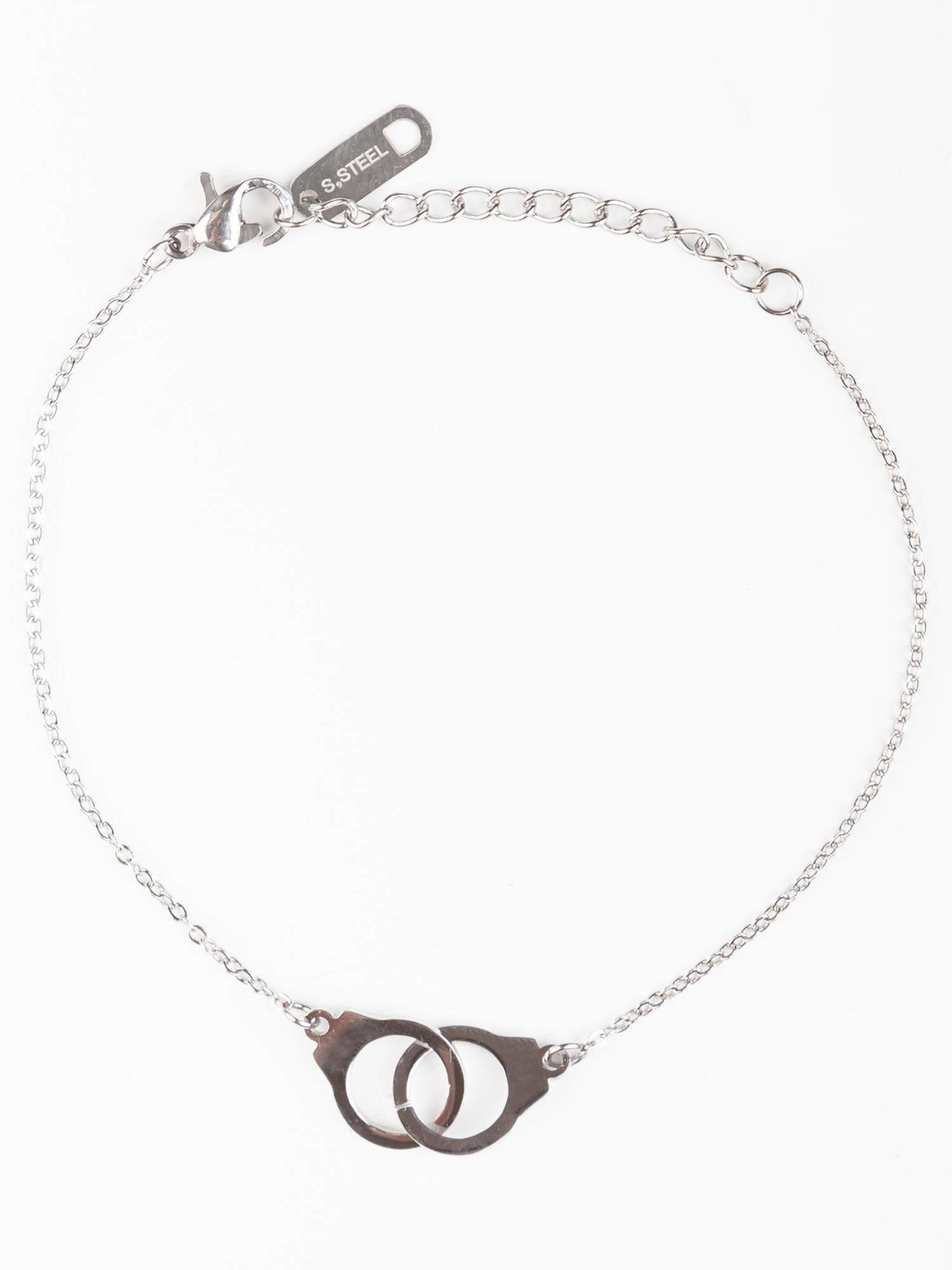 Bracelet on a silver chain decorated with handcuff pendants