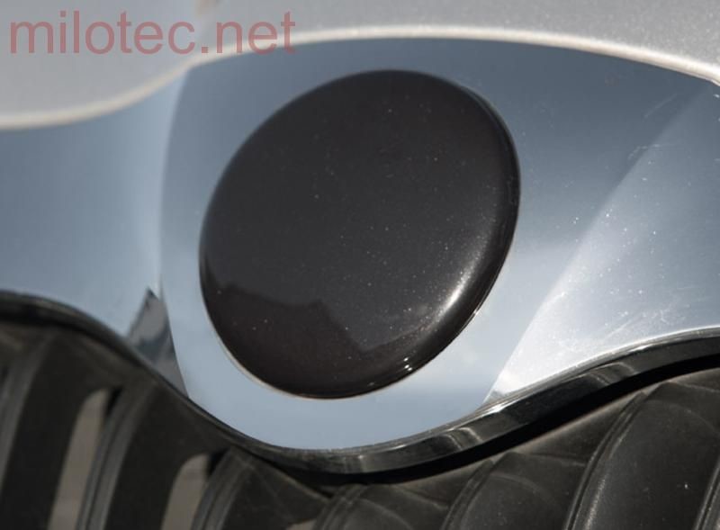 Milotec Kryt emblému - přední, černá metalíza,Škoda Octavia II. Facelift 12/08–›