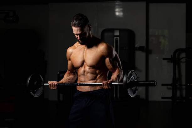 Wirestock Umělecká fotografie Biceps Exercise With Barbell, Wirestock, (40 x 26.7 cm)