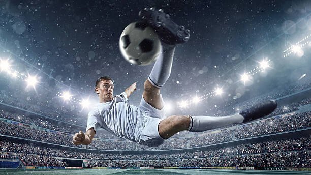Dmytro Aksonov Umělecká fotografie Soccer player kicking ball in stadium, Dmytro Aksonov, (40 x 22.5 cm)