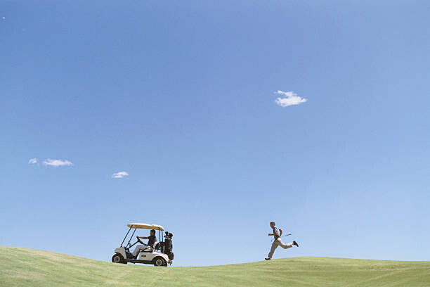 Sean Justice Umělecká fotografie Golfer Chasing Golf Cart, Sean Justice, (40 x 26.7 cm)