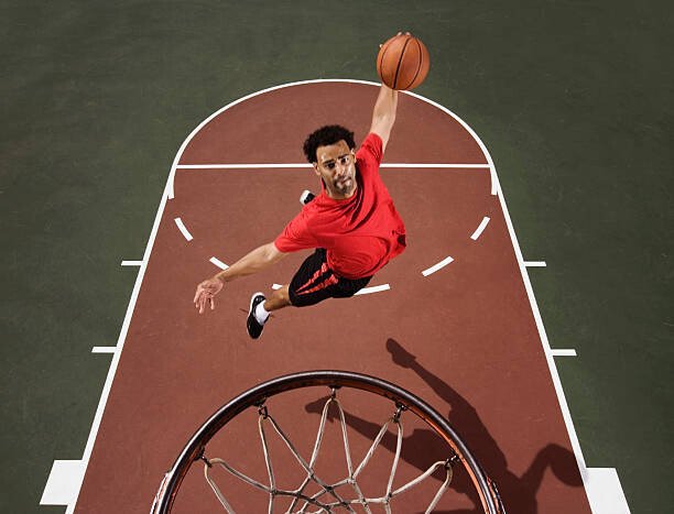 Jupiterimages Umělecká fotografie Basketball player dunking basketball, Jupiterimages, (40 x 30 cm)