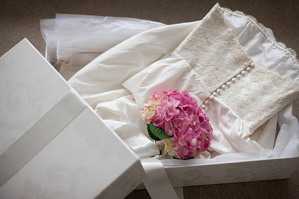 Tom Merton Umělecká fotografie Pink hydrangea on wedding dress  in box, Tom Merton, (40 x 26.7 cm)