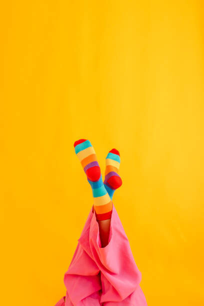 Westend61 Umělecká fotografie Woman wearing colorful socks against yellow, Westend61, (26.7 x 40 cm)