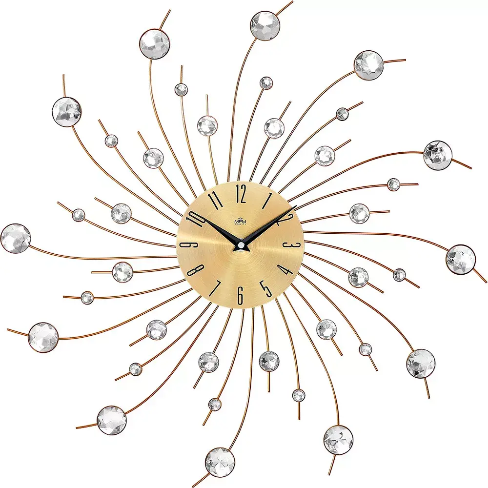 Kovové hodiny paprskovitého tvaru ozdobeného broušenými kamínky. Díky hodinovému strojku s plynulým chodem neruší hodiny nepříjemným tikáním E04.4496 MPM Gaia