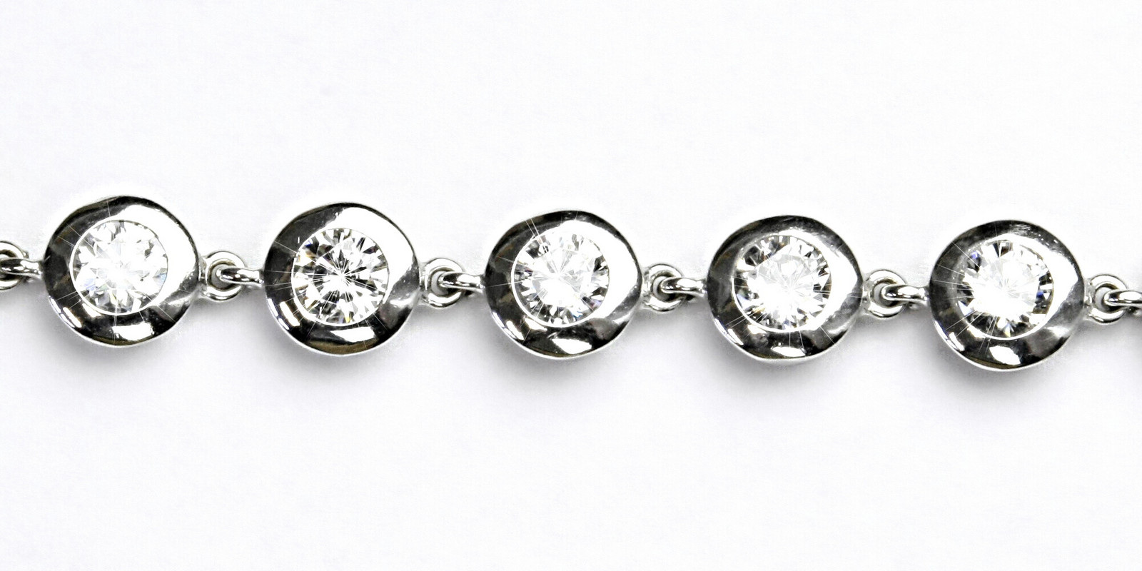 Stříbrný náramek s čirými zirkony, R 1046