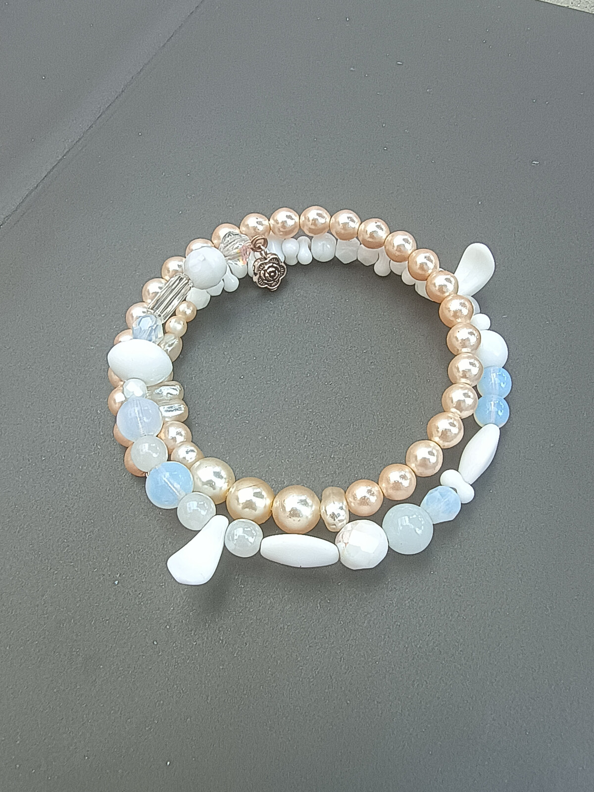 Emada Náramek, 2010, paměťový drát, Bílé zoubky, 1 ks