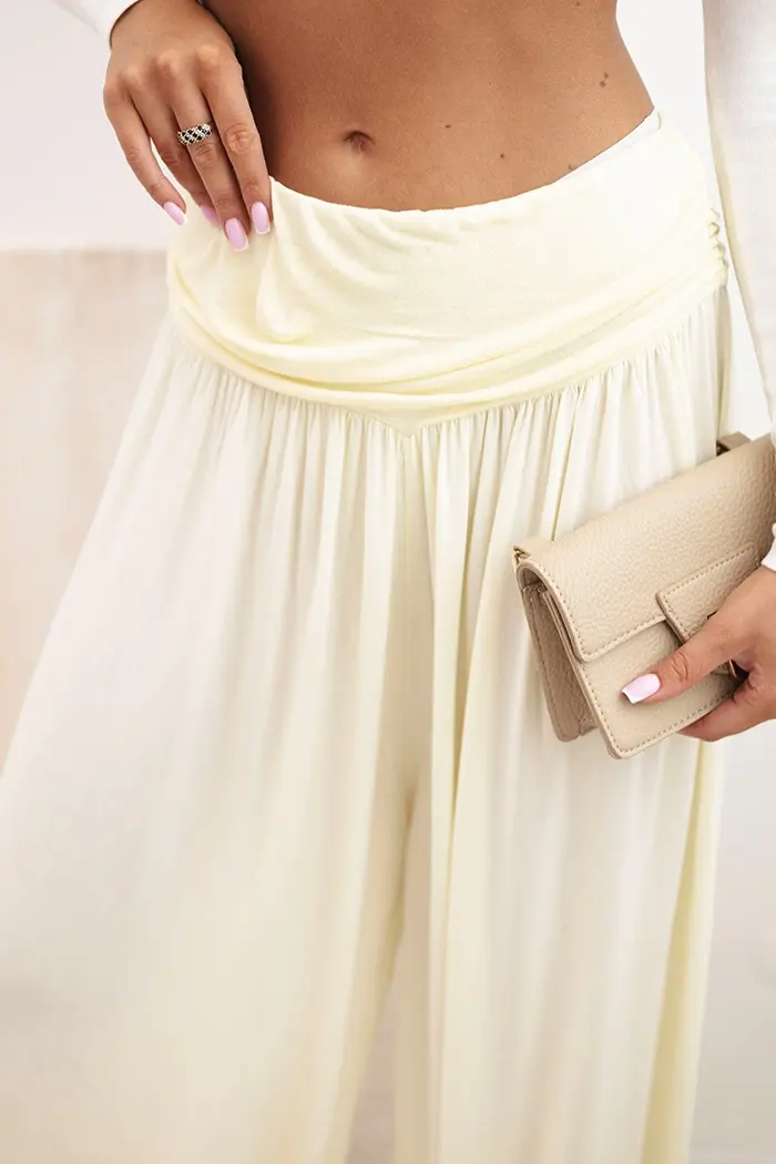 Kesi Włoski Dámské viskózové kalhoty s širokými nohavicemi a volánky žlutý