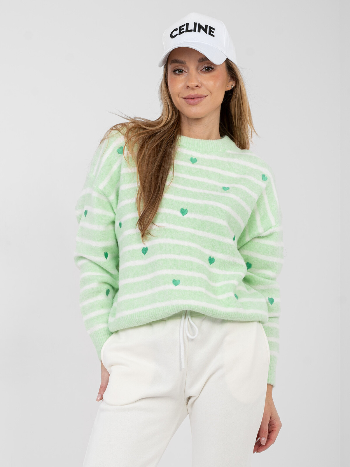 Světle zelený svetr s pruhy