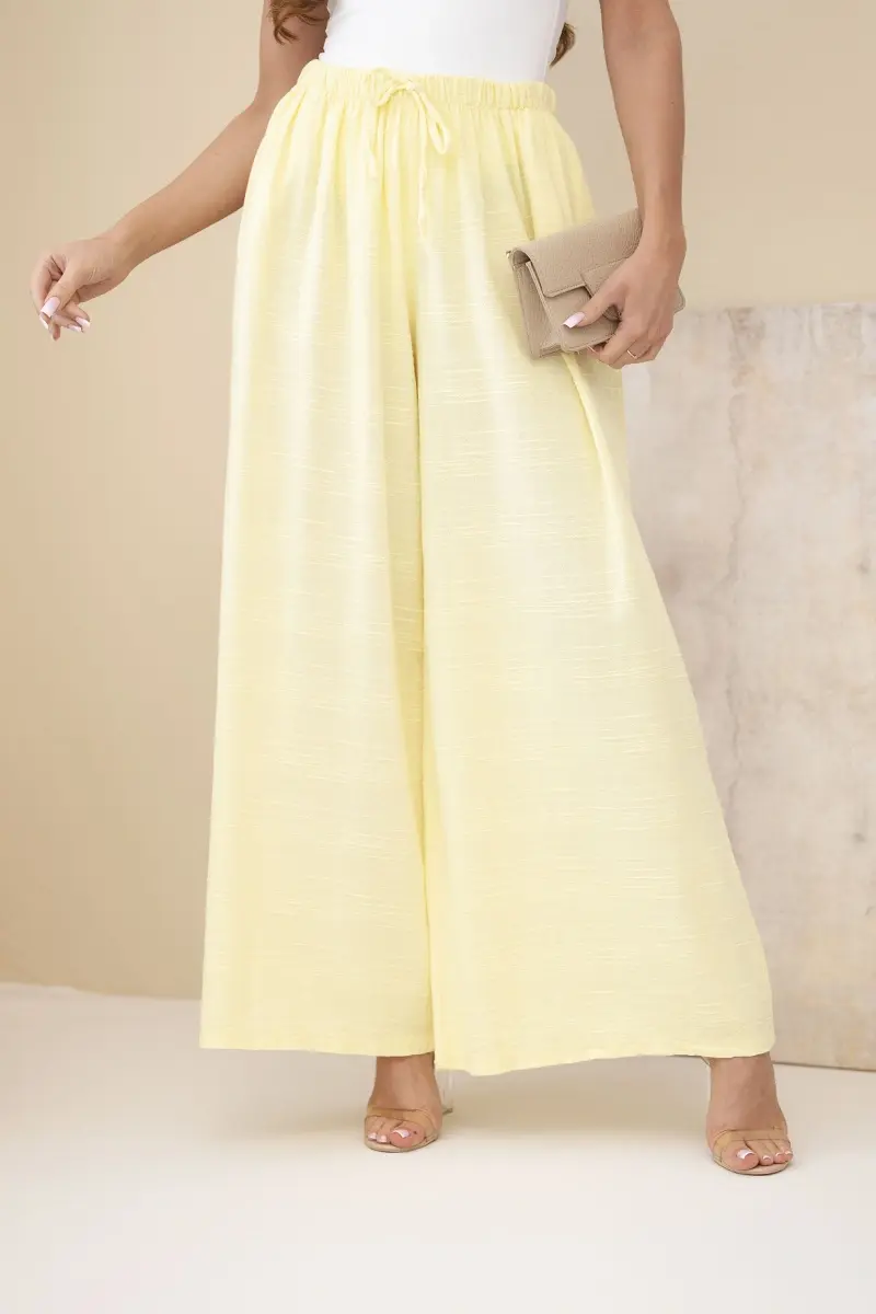 Kesi žluté dámské široké kalhoty z bavlny