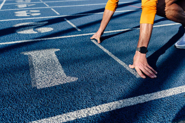 Westend61 Plakát, Obraz - Sportsman at starting line of running track, Westend61, 40 × 26.7 cm