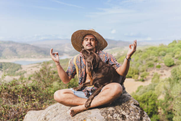 Rawlstock Plakát, Obraz - young man meditating in nature with his dog., Rawlstock, 40 × 26.7 cm
