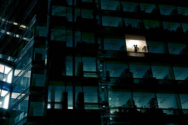 Nick Dolding Plakát, Obraz - Office building at night, man standing, Nick Dolding, 40 × 26.7 cm