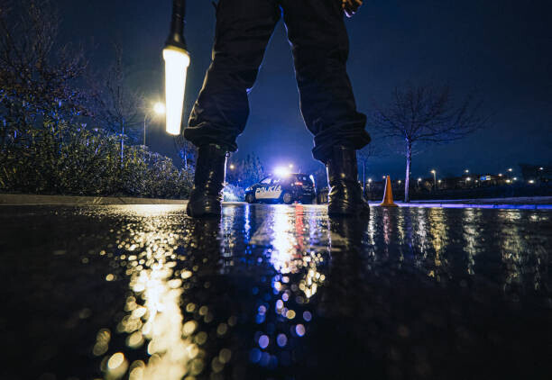 Carrastock Plakát, Obraz - Unrecognizable police officers in rainy night, Carrastock, 40 × 26.7 cm