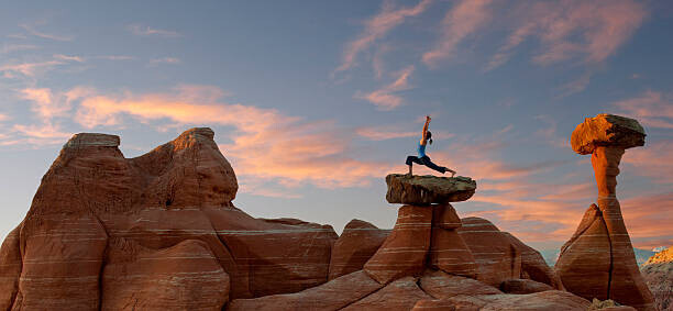 Pete Saloutos Plakát, Obraz - Caucasian woman practicing yoga on top, Pete Saloutos, 50 × 23.2 cm