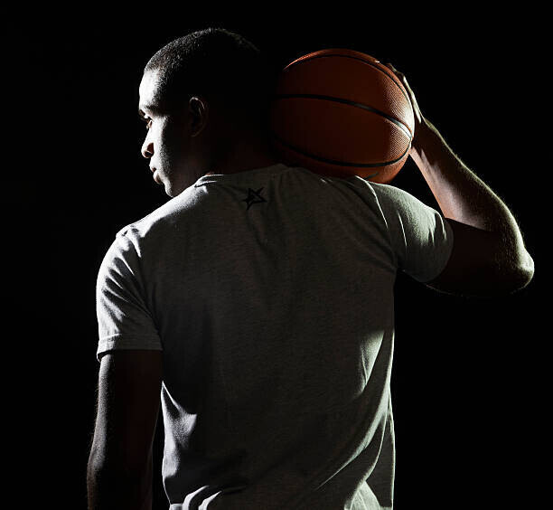 Tara Moore Plakát, Obraz - man holding basketball on shoulder, Tara Moore, 40 × 40 cm