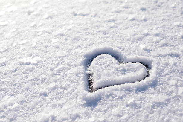 Vitalii Petrushenko Plakát, Obraz - Small heart shape on snow with, Vitalii Petrushenko, 40 × 26.7 cm