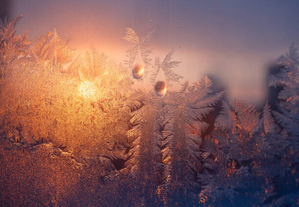 Sergiy Trofimov Photography Plakát, Obraz - Frosty window with drops and ice pattern at sunset, Sergiy Trofimov Photography, 40 × 26.7 cm