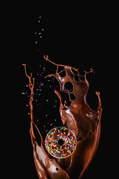 Dina Belenko Photography Plakát, Obraz - Chocolate splash and a donut with, Dina Belenko Photography, 26.7 × 40 cm