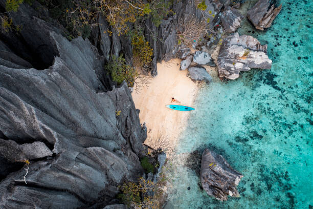 © Marco Bottigelli Plakát, Obraz - Aerial view of woman with kayak, © Marco Bottigelli, 40 × 26.7 cm