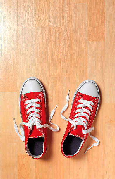 Peter Dazeley Plakát, Obraz - Trainers on wooden floor, Peter Dazeley, 26.7 × 40 cm
