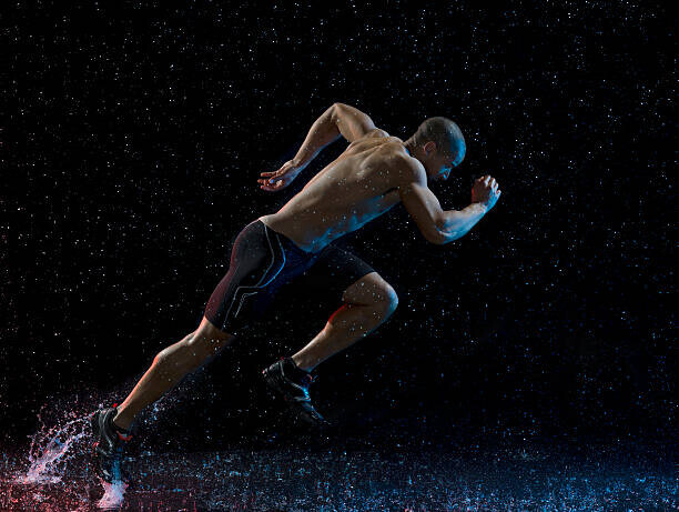 Jonathan Knowles Plakát, Obraz - Athlete runner running through rain, Jonathan Knowles, 40 × 30 cm