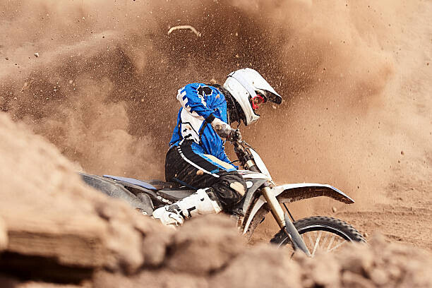 Daniel Milchev Plakát, Obraz - Motocross biker taking a turn in the dirt., Daniel Milchev, 40 × 26.7 cm