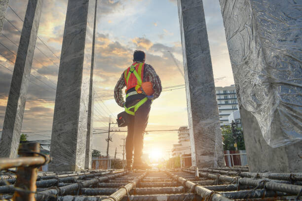 Cavan Images Plakát, Obraz - Working at height equipment on during sunset, Cavan Images, 40 × 26.7 cm