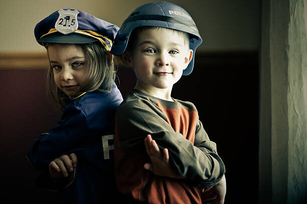 Rebecca Nelson Plakát, Obraz - Boy and girl twins dressed up as police officers, Rebecca Nelson, 40 × 26.7 cm
