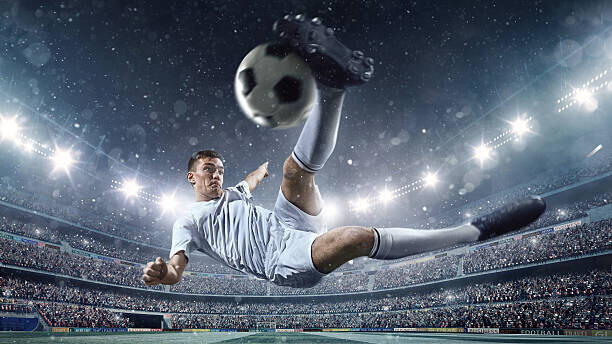 Dmytro Aksonov Plakát, Obraz - Soccer player kicking ball in stadium, Dmytro Aksonov, 40 × 22.2 cm