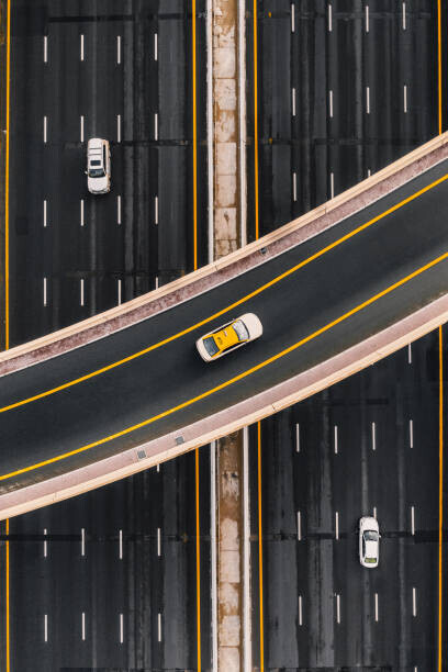 Abstract Aerial Art Plakát, Obraz - Taxi on an overpass crossing above, Abstract Aerial Art, 26.7 × 40 cm