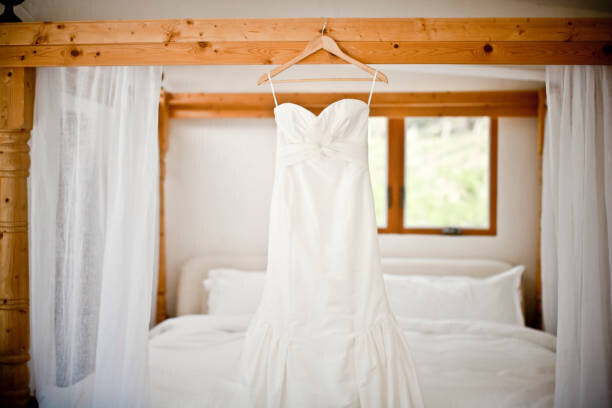 Cavan Images Plakát, Obraz - Wedding dress hanging bed, Cavan Images, 40 × 26.7 cm