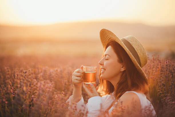Polina Lebed Plakát, Obraz - Young happy woman drinking herbal tea,, Polina Lebed, 40 × 26.7 cm