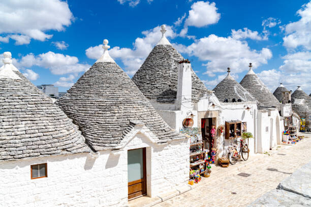Roberto Moiola / Sysaworld Plakát, Obraz - White Trulli huts in summer, Alberobello, Puglia, Roberto Moiola / Sysaworld, 40 × 26.7 cm