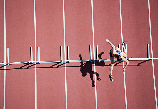 Paul Bradbury Plakát, Obraz - Runner jumping hurdles on track, Paul Bradbury, 40 × 26.7 cm