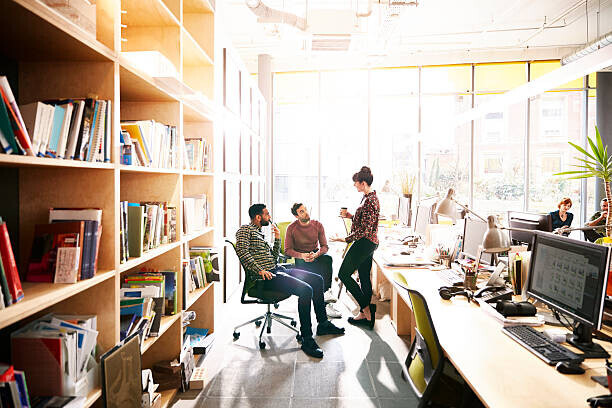 Ezra Bailey Plakát, Obraz - Creative coworkers chatting over ideas in office, Ezra Bailey, 40 × 26.7 cm