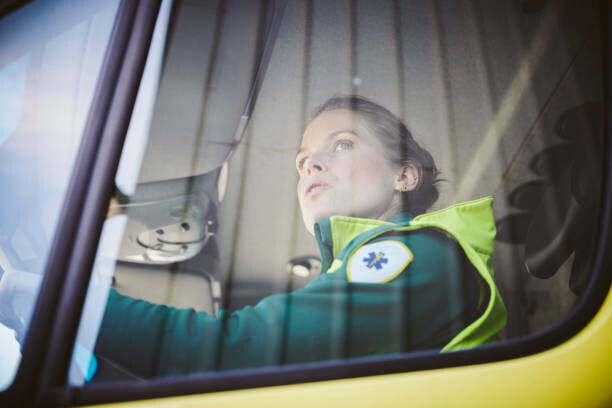 Maskot Plakát, Obraz - Thoughtful mid adult paramedic sitting in, Maskot, 40 × 26.7 cm