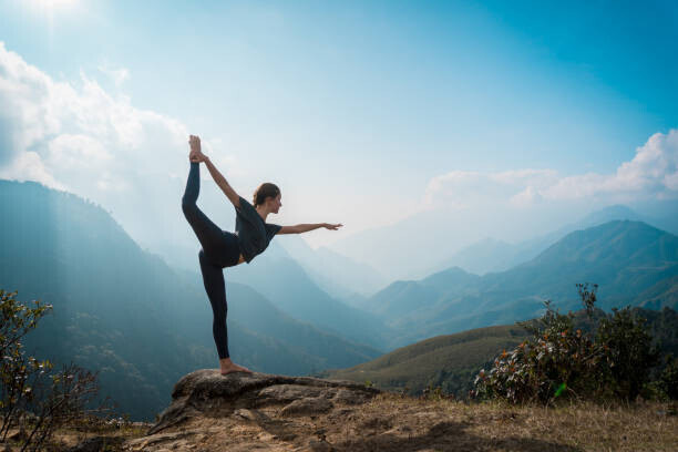 Zulman Plakát, Obraz - Woman training yoga, mountains on background, Zulman, 40 × 26.7 cm