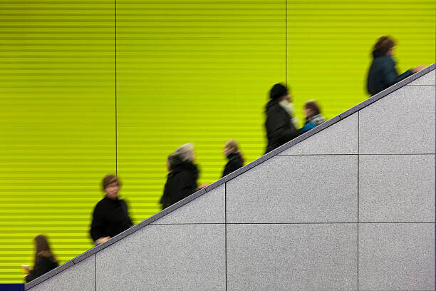 sebastian-julian Plakát, Obraz - Civilians riding an escalator with a, sebastian-julian, 40 × 26.7 cm