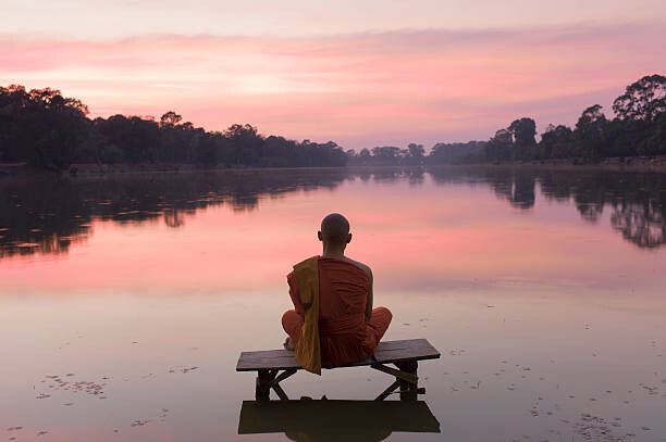 Martin Puddy Plakát, Obraz - Cambodia, Angkor Wat, Buddhist Monk at sunset, Martin Puddy, 40 × 26.7 cm