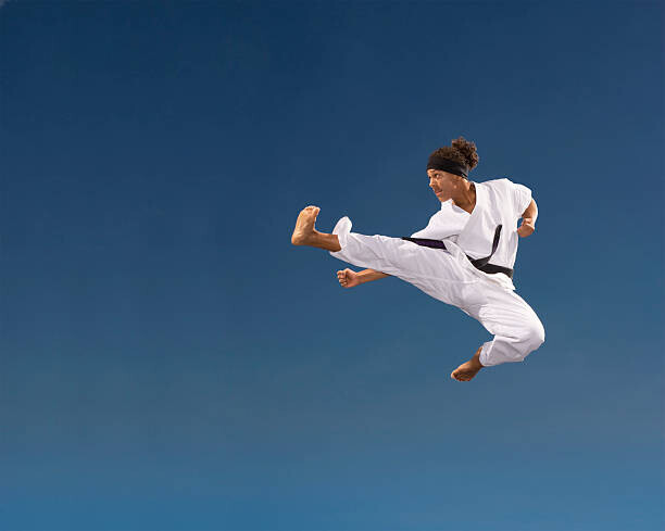Siri Stafford Plakát, Obraz - Teenage boy  kicking in mid-air,, Siri Stafford, 40 × 30 cm