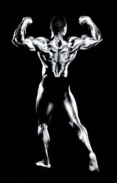 Robert Daly Plakát, Obraz - Male bodybuilder flexing muscles, rear view (B&W), Robert Daly, 26.7 × 40 cm