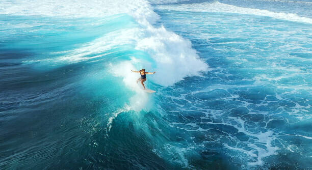 graphixel Plakát, Obraz - Surfer woman riding on the blue ocean, graphixel, 40 × 22.2 cm
