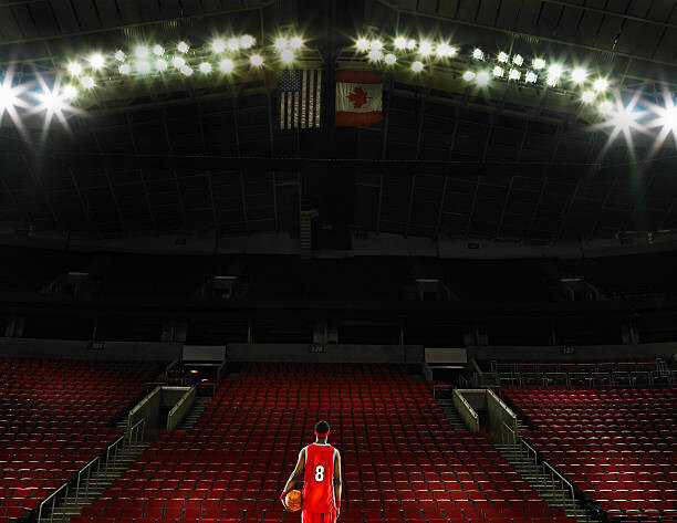 Ryan McVay Plakát, Obraz - Basketball player standing on court holding, Ryan McVay, 40 × 30 cm