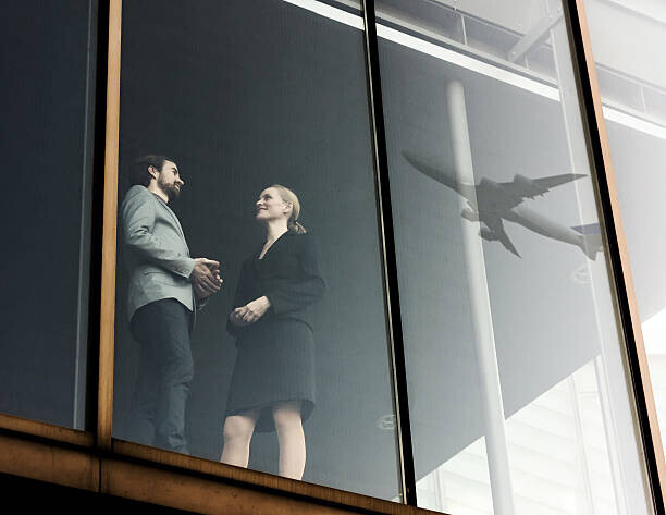 Hinterhaus Productions Plakát, Obraz - Business Travellers With Airplane Reflecting, Hinterhaus Productions, 40 × 30 cm