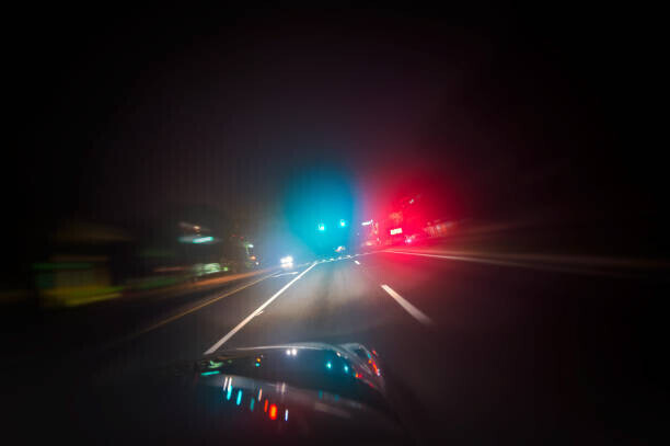Hillary Kladke Plakát, Obraz - Car driving down road with red and blue lights, Hillary Kladke, 40 × 26.7 cm